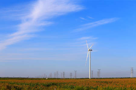 Windmill in the blue sky background