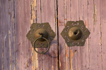 Door knobs on door panels, close-up photosの写真素材