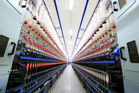 The modern spinning machine works in the workshopのeditorial素材