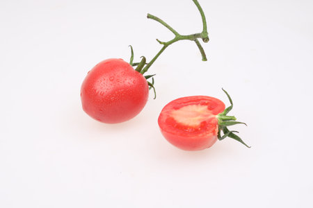 Fresh tomatoes on a white backgroundの写真素材