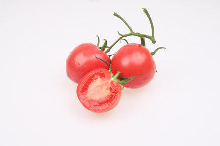 Fresh tomatoes on a white backgroundの写真素材