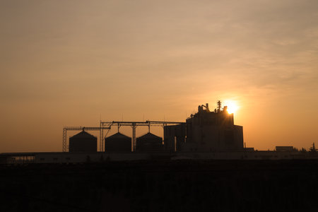 A silhouette of a feed factory in the morningの写真素材