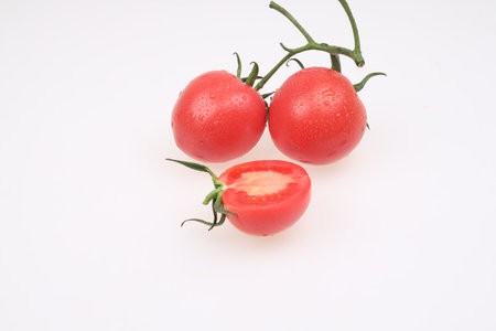 Fresh tomatoes on a white backgroundの写真素材
