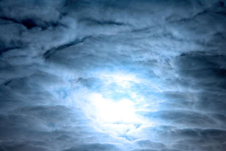 The fantastic sky with clouds and the sun... or the moon