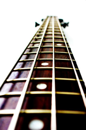 Neck of a bass guitar with silver stringsの写真素材