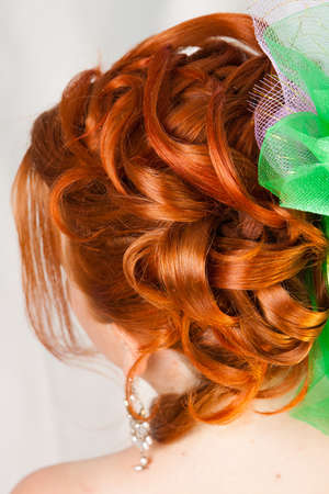 Hairdress of the girl with red hairの写真素材