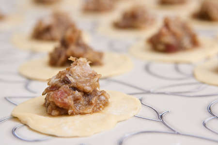 Pelmeni on a table with a dim back backgroundの写真素材