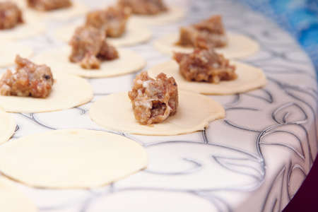 Pelmeni - traditional russian dish. Preparation, selective focusの写真素材