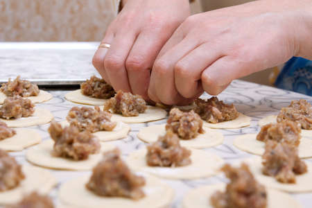 Moulding hands of pelmeni. Preparation, selective focusの写真素材