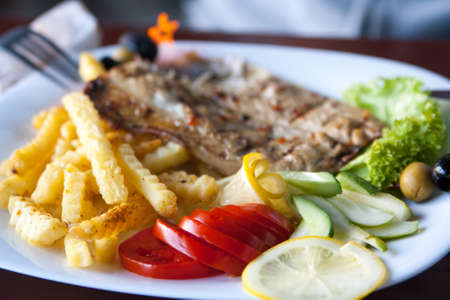 serving of fish and chips on backgroundの写真素材
