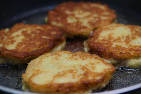 Belarusian potato pancakes fried in a pan
