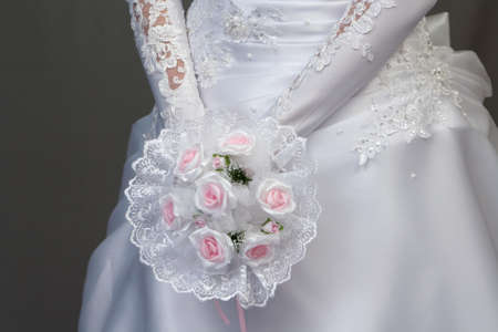 bride with pink roses bouquetの写真素材