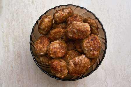 Meat patties in the plate on the table