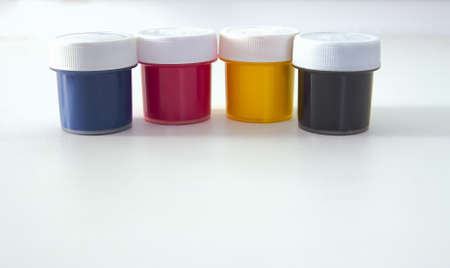 The colored paint bucket CMYKの写真素材
