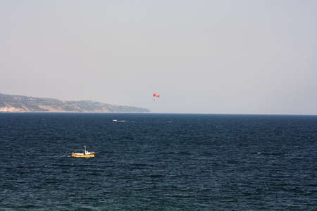 Parachuting at sea, Parasailing with a boat over the seaの写真素材