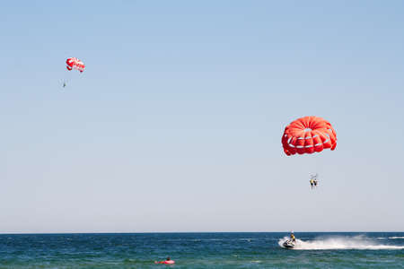 Parachuting at sea, Parasailing with a boat over the seaの写真素材