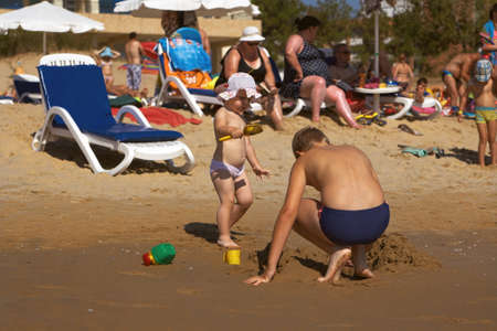 Sunny Beach, Bulgaria - August 24, 2015: Children playing with toys on the beach on the Black Seaのeditorial素材