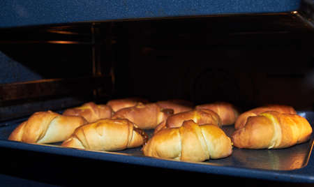 Ruddy homemade cakes in a pan. In the oven. Part of a set