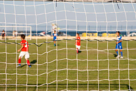 Young football players on the field near the Black Seaの写真素材