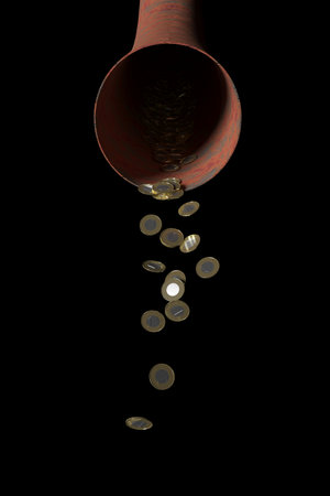 Coins falling from a gold pipe on a black background.の写真素材