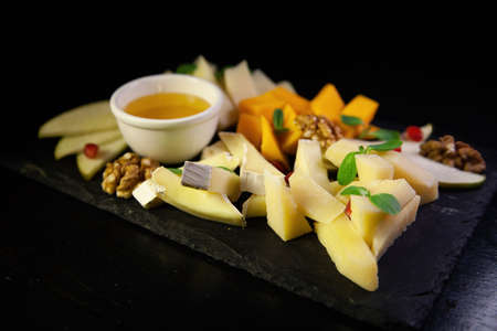 Assorted fruit on a black backgroundの写真素材