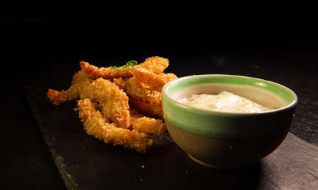 Cheese sticks in batter and sauce. Serving dishes at the restaurant.の写真素材