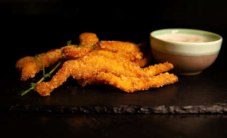 Cheese sticks in batter and sauce. Serving dishes at the restaurant.の写真素材
