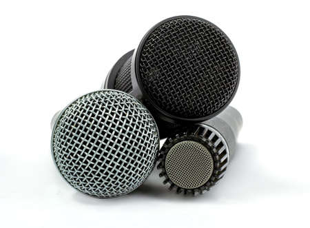 one condenser microphone and two dynamic microphones, isolated on white backgroundの写真素材