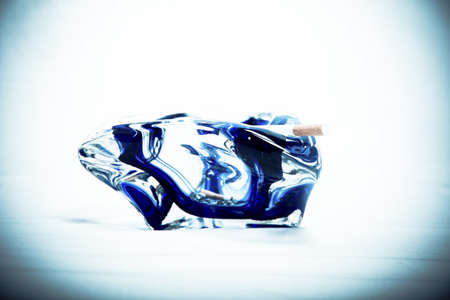 ashtray with a burning cigaretteの写真素材