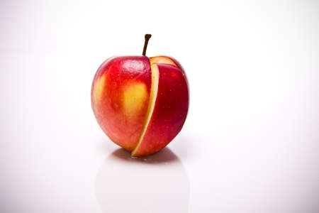 a sliced apple in front of white backgroundの写真素材