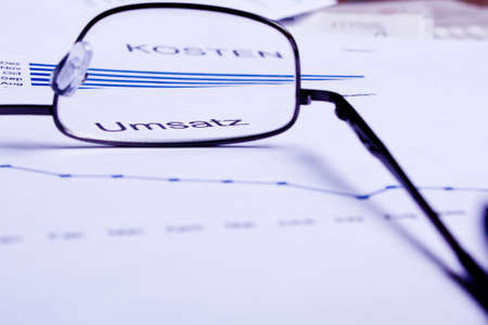 different business documents, viewed trough some glasses