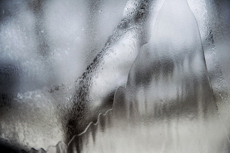 Frozen ice on a window pane on a frosty dayの写真素材