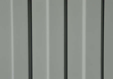 Gray profile metal sheet in the sun backgroundの写真素材