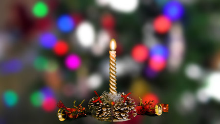 Burning Christmas candles on a wooden table. Symbol of peace.の写真素材