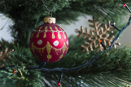 Multicolored Christmas balls, toys and garland on the Christmas treeの写真素材