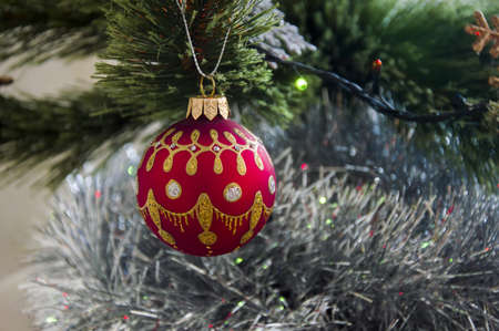Multicolored Christmas balls, toys and garland on the Christmas treeの写真素材