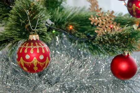 Multicolored Christmas balls, toys and garland on the Christmas treeの写真素材