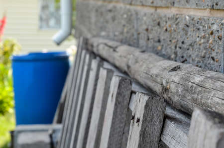 Fragment of an old wooden ladder with rusty nailsの写真素材