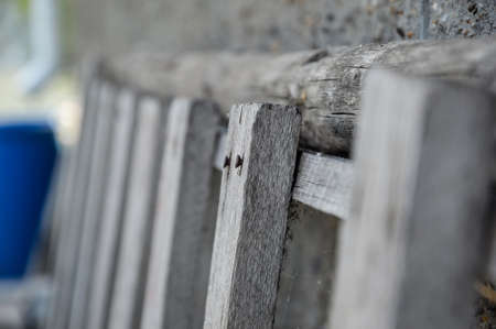 Fragment of an old wooden ladder with rusty nailsの写真素材