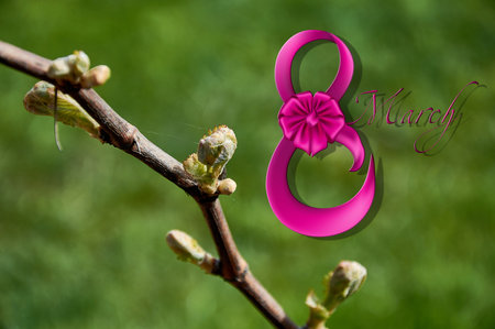 A postcard for March 8 on a blurry background of green grass.