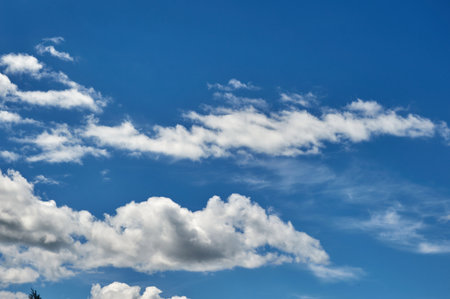 White clouds against a natural blue skyの写真素材