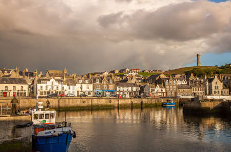 Macduff colorful Harbortown at sunset scotlandの写真素材