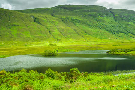 Hills and Lake green landscape Highlands Scotland