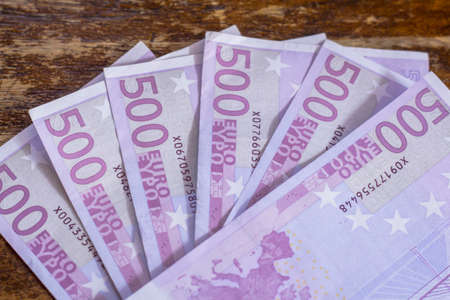 Euro money notes X Notes on rustic wooden backgroundの写真素材