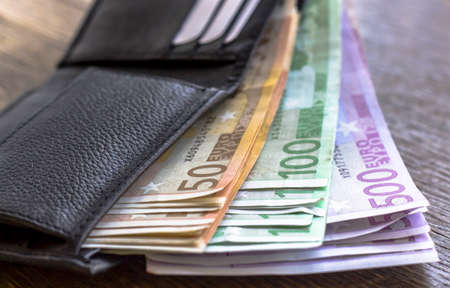 Euro money notes in the wallet on rustic wooden Backgroundの写真素材