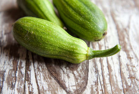 harvest fresh  green pumpkins on rustic wooden background with copy spaceの写真素材