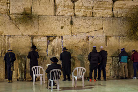 praying people at the western wall in the evening Jerusalem religion travel israel