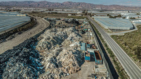 Above view of Mountains of plastic waste from the fruit and vegetable growing greenhouses in...