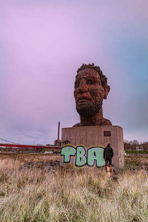 Bronze statue by the sculptor Markus Luepertz  Echo des Poseidon at the port of Duisburg Germanyのeditorial素材