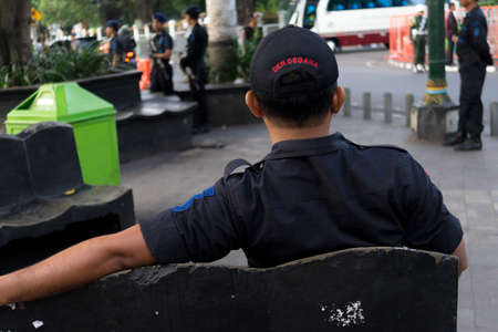 Military Guard sitting on benchのeditorial素材